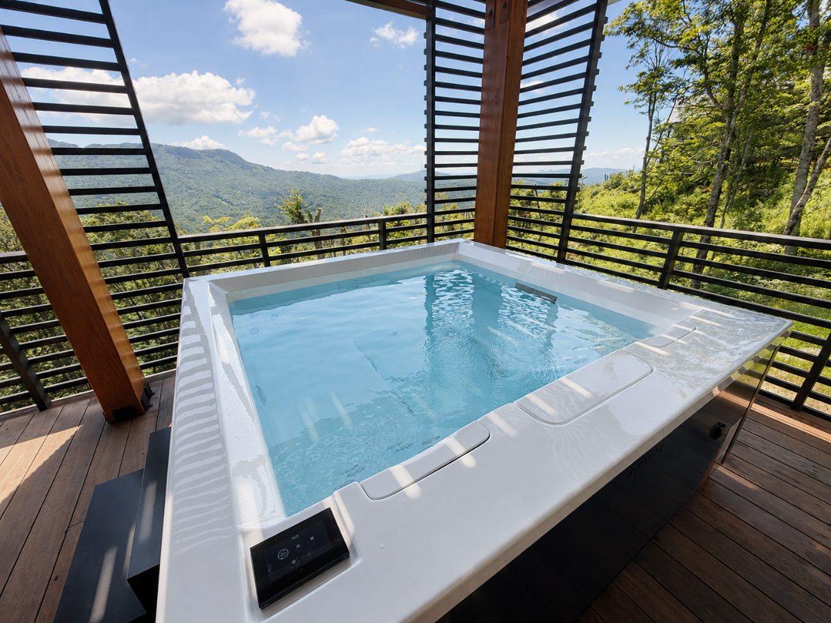 Newly filled square hot tub on a louvered mountain deck after install and startup, Boone NC