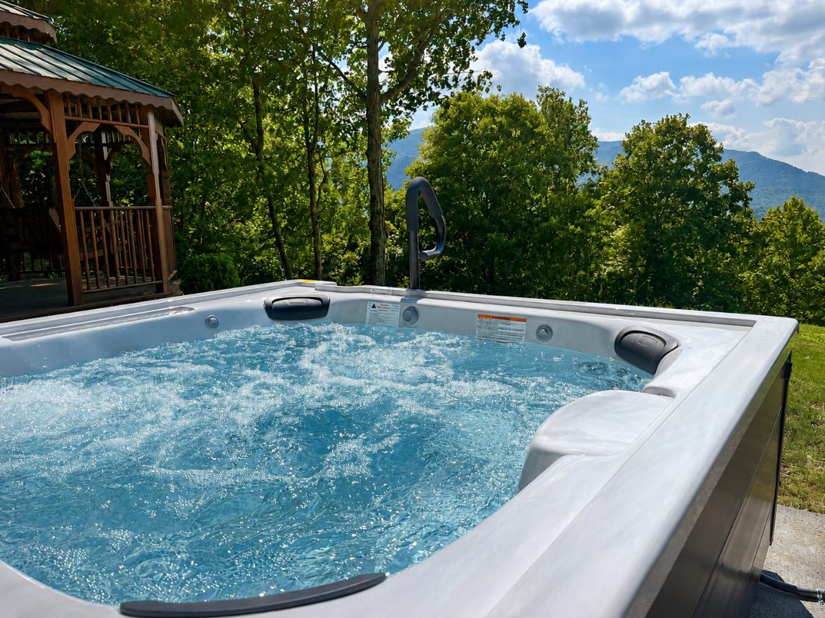 Hot tub with jets running and clear balanced water overlooking the mountains in Watauga County NC